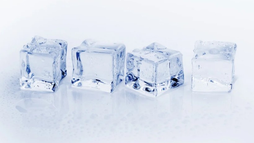 Four pieces ice cubes start to melt