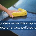 Why does water bead up on the surface of a wax-polished car