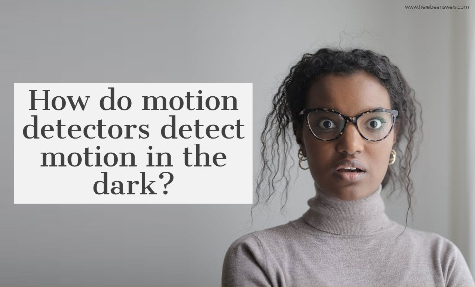 How do motion detectors detect motion in the dark