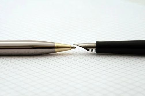 A ballpoint and a tipped fountain pen