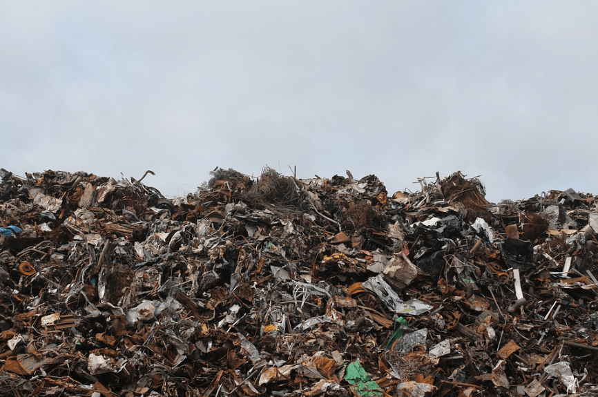 a pile of garbage in a landfill